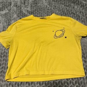 It’s is a size 2, yellow space crop top